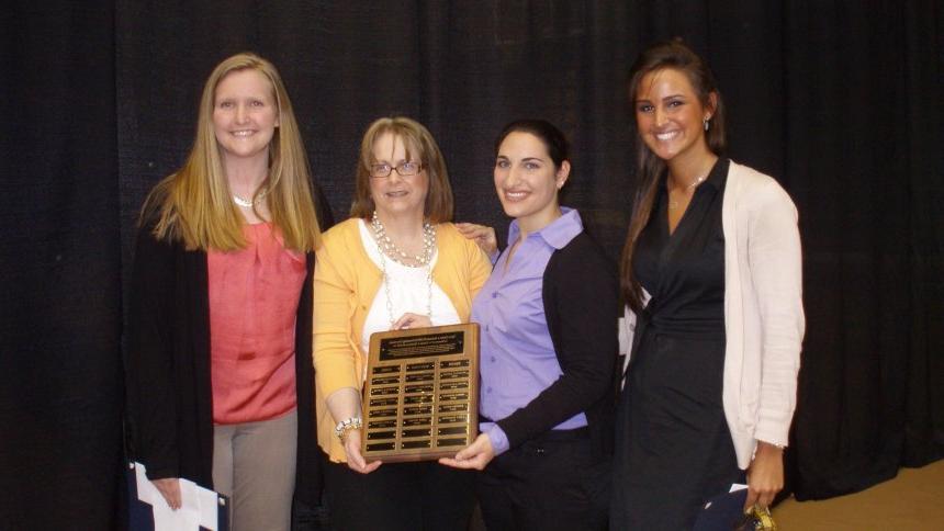 From left: 2012 Henderson Outstanding Tutor Award recipients Casey Klosowski in math, Lauren Salerno in science, (Coordinator of the Writing Center Karen Bilotti) and Leigh Wilmot in writing.