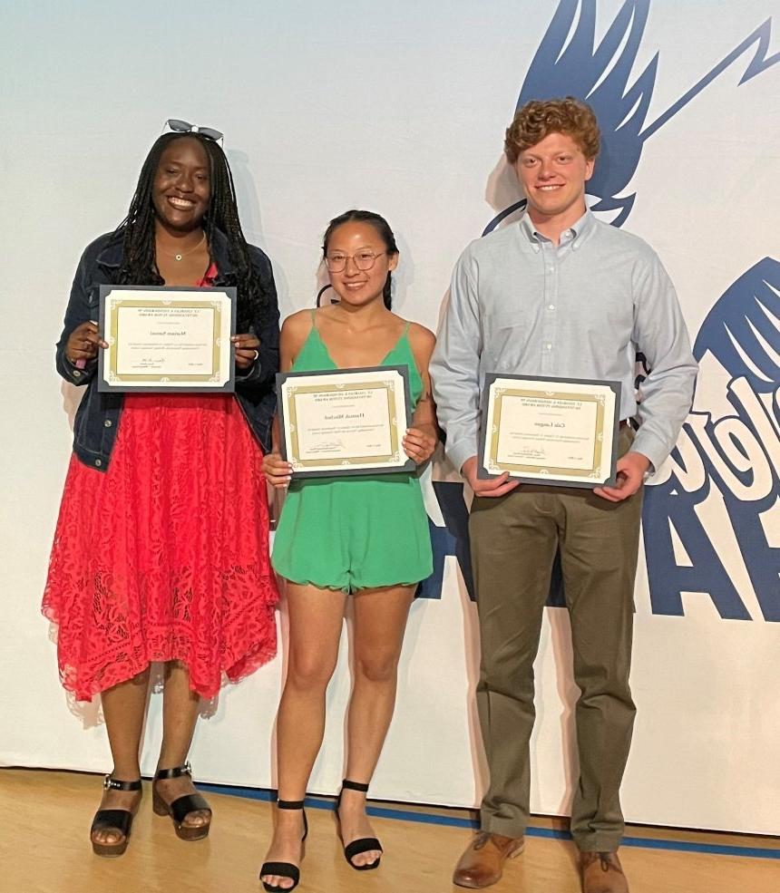 Henderson Outstanding Tutors for 2023 pose inside holding certificates