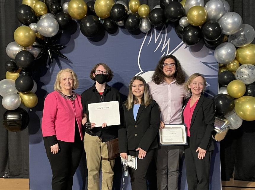 Henderson Outstanding Tutors for 2024 pose inside holding certificates